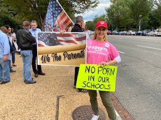 Parent with school signs